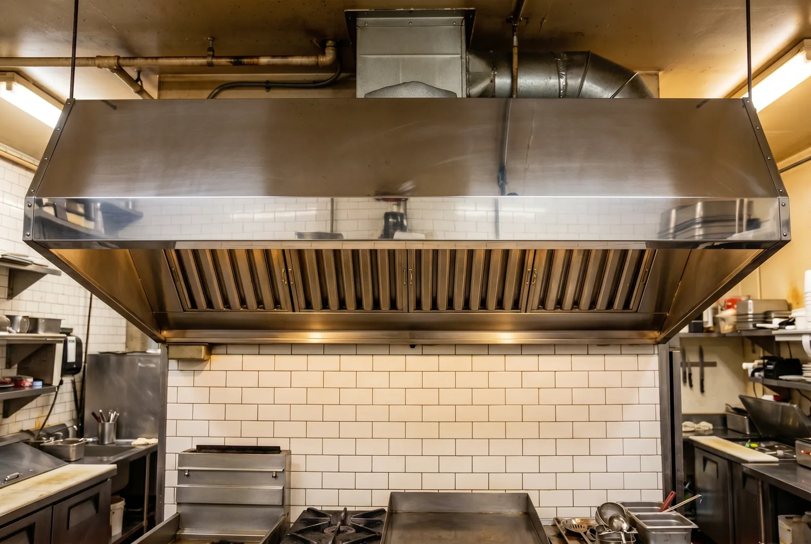 Greasy range hood after a Spotless professional clean